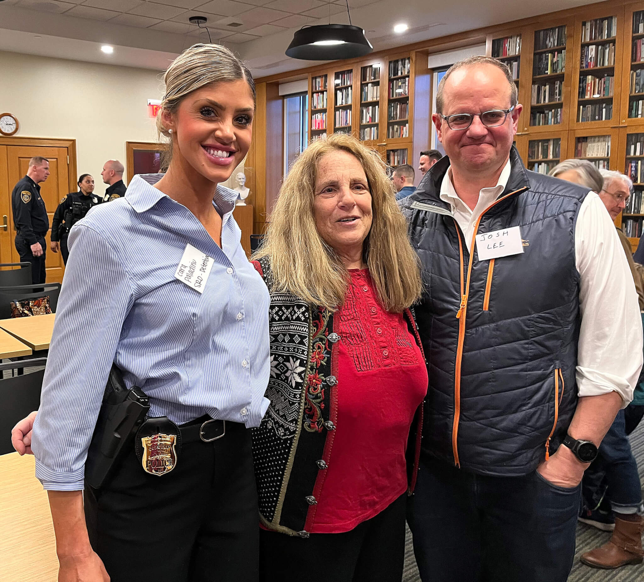 Officer Cara Paladino, l., with Select Board member Terri Ackerman and DEI co-chairman Josh Lee.